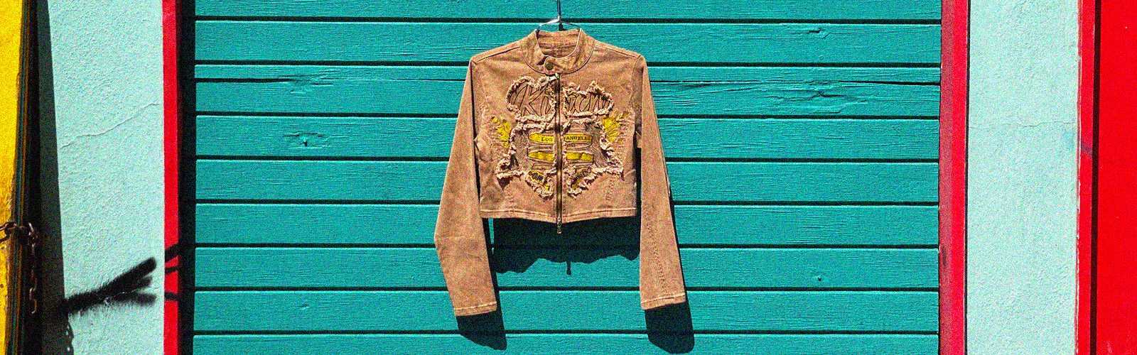 a brown jacket with yellow patches on it