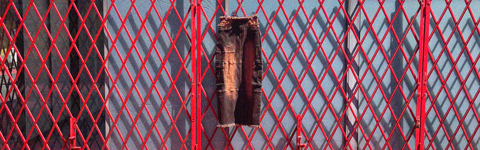 a piece of clothing on a metal fence